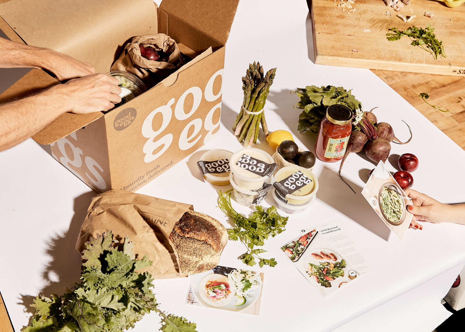 Good Eggs box contents of fresh vegetables and greens