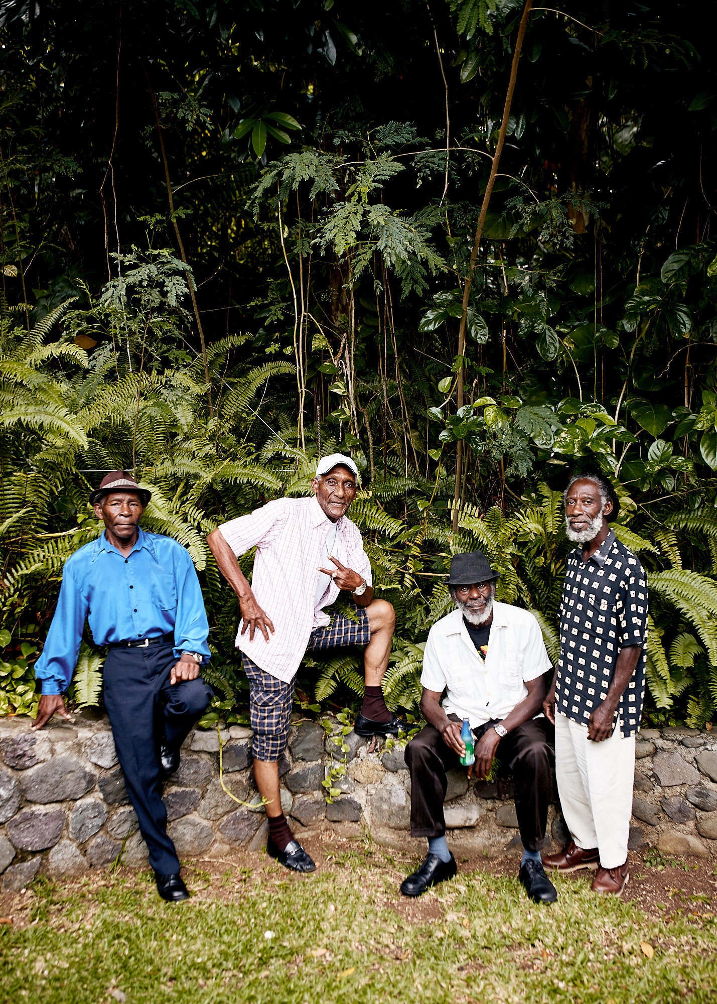 Four older men in smart wear from Jamaica