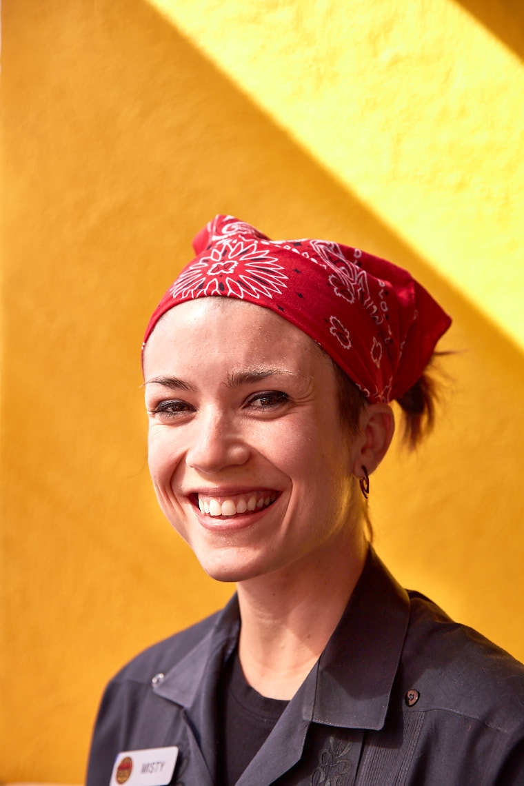 Portrait of woman in red handkerchief and work attire for Google Fiber