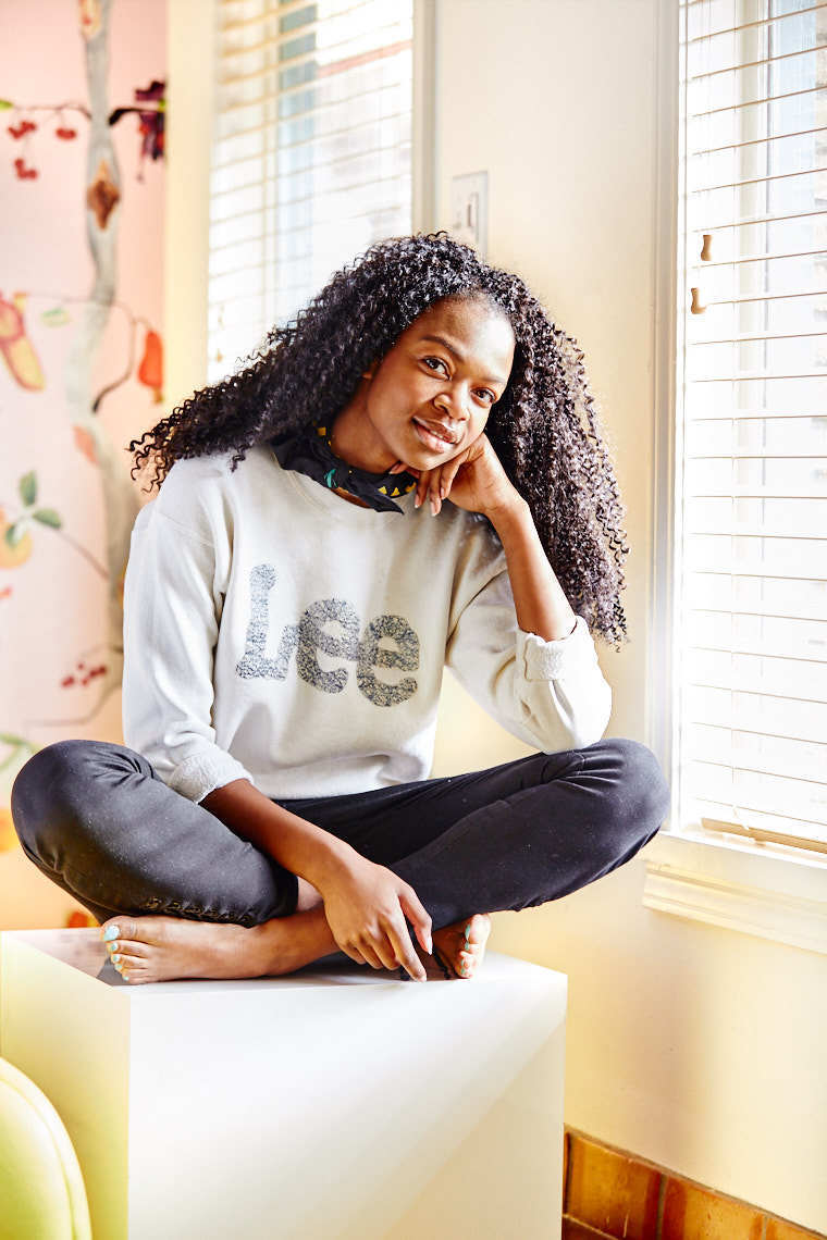 Atlanta Brown posing in white Lee Jeans long sleeve shirt